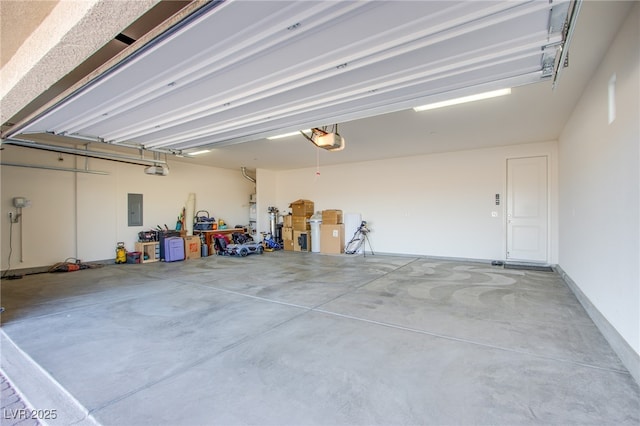 8665 Jerlyn St, Las Vegas, NV 89113 - garage with a garage door opener and electric panel