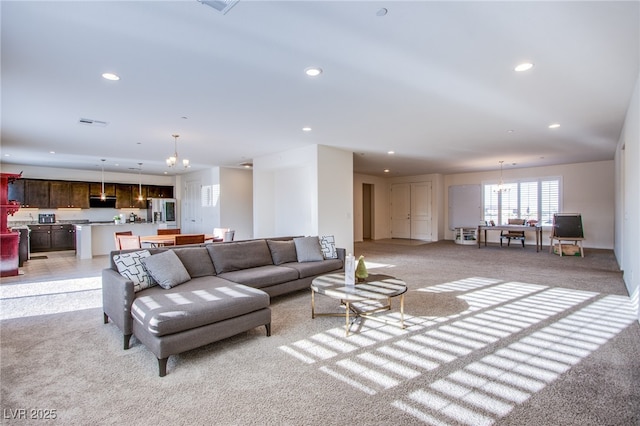 8665 Jerlyn St, Las Vegas, NV 89113 - living area featuring light colored carpet, recessed lighting, and a chandelier