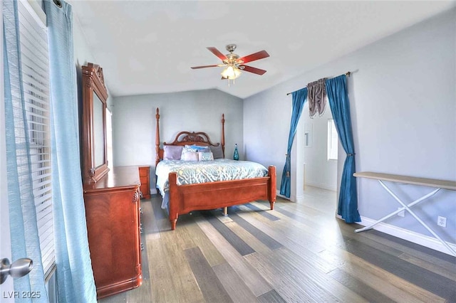 6233 Overhang Ave, Henderson, NV 89011 - bedroom with wood finished floors, baseboards, lofted ceiling, and ceiling fan