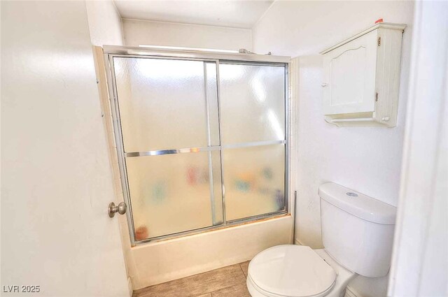 6233 Overhang Ave, Henderson, NV 89011 - bathroom with toilet and bath / shower combo with glass door
