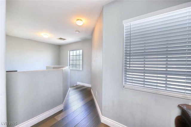 6233 Overhang Ave, Henderson, NV 89011 - hallway featuring an upstairs landing, wood finished floors, and baseboards
