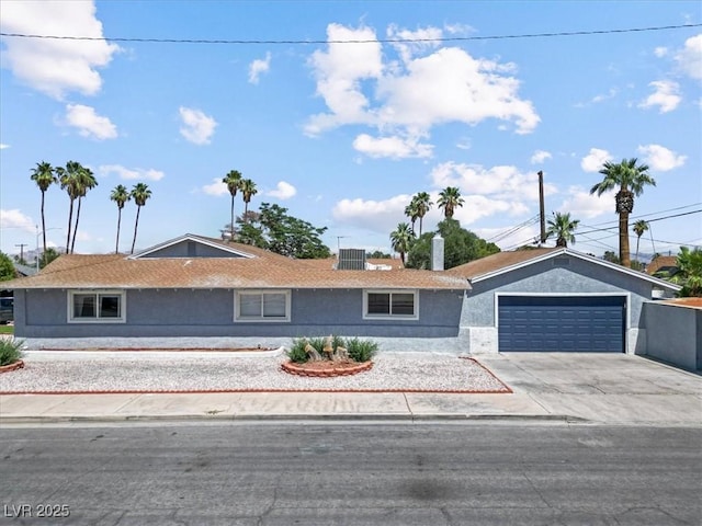 1700 E Oakey Blvd, Las Vegas, NV 89104 - ranch-style home with stucco siding, driveway, and an attached garage
