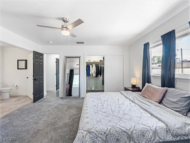 1700 E Oakey Blvd, Las Vegas, NV 89104 - carpeted bedroom featuring a closet, ensuite bathroom, a ceiling fan, and baseboards