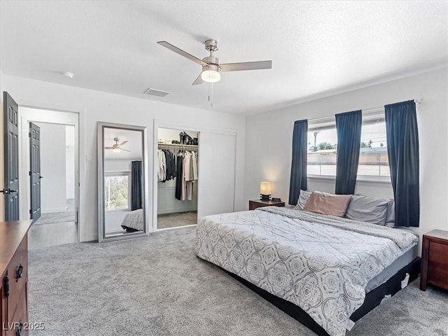 1700 E Oakey Blvd, Las Vegas, NV 89104 - bedroom with carpet flooring, multiple windows, and ceiling fan