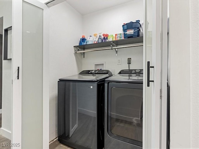 1700 E Oakey Blvd, Las Vegas, NV 89104 - washroom with separate washer and dryer and wood finished floors