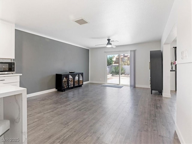 1700 E Oakey Blvd, Las Vegas, NV 89104 - unfurnished living room with ceiling fan, light wood-style flooring, and baseboards