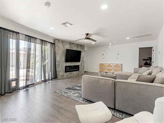 1700 E Oakey Blvd, Las Vegas, NV 89104 - living area with wood finished floors, a fireplace, ceiling fan, and recessed lighting