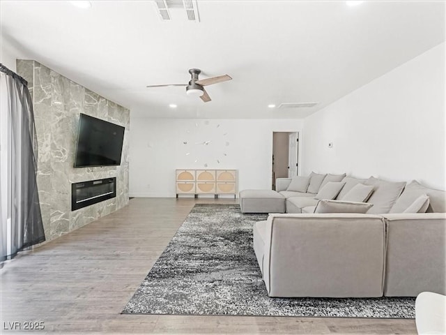 1700 E Oakey Blvd, Las Vegas, NV 89104 - living room featuring recessed lighting, wood finished floors, ceiling fan, and a fireplace