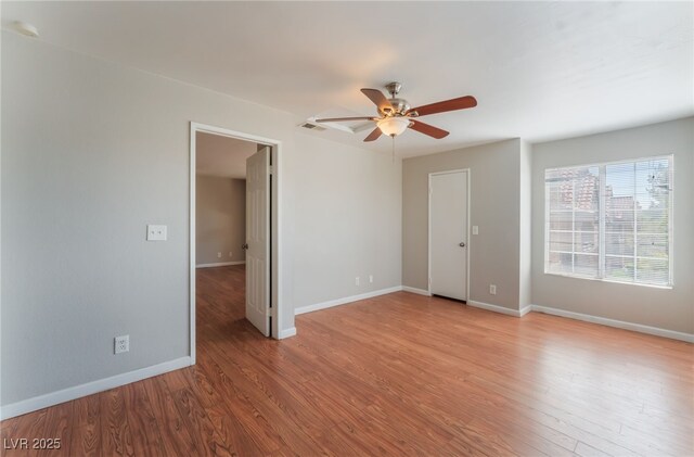 2200 S Fort Apache Rd Unit 2015, Las Vegas, NV 89117 - spare room featuring ceiling fan, light wood-type flooring, and baseboards
