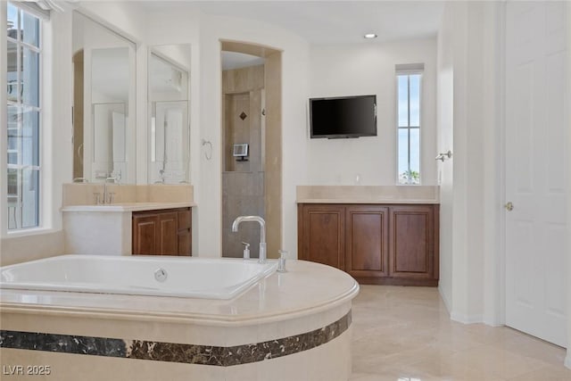 11503 Glowing Sunset Ln, Las Vegas, NV 89135 - full bathroom featuring a bath, a shower stall, and vanity