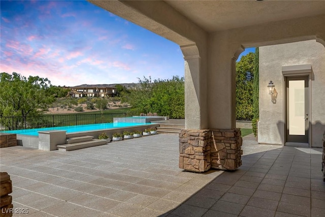 11503 Glowing Sunset Ln, Las Vegas, NV 89135 - view of patio / terrace with an outdoor pool
