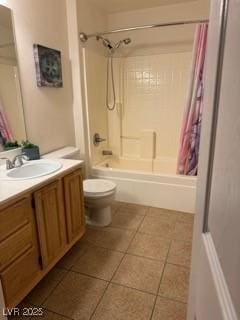 5855 Valley Dr Unit 1070, North Las Vegas, NV 89031 - full bathroom with tile patterned floors, vanity, and shower / bathtub combination with curtain