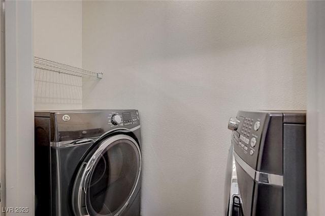 2900 Sunridge Heights Pkwy Unit 518, Henderson, NV 89052 - laundry room featuring washing machine and clothes dryer