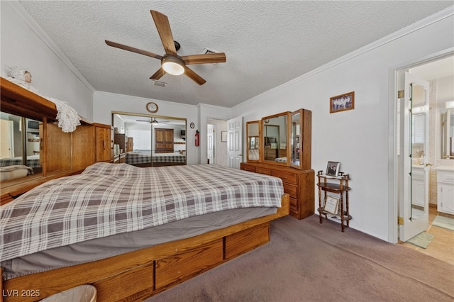 22 Jade Cir, Las Vegas, NV 89106 - bedroom with carpet, a textured ceiling, crown molding, ceiling fan, and ensuite bath