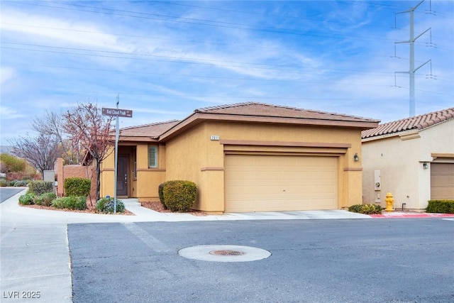 7611 Redcloud Peak St, Las Vegas, NV 89166 - view of front facade with stucco siding, a tile roof, and a garage