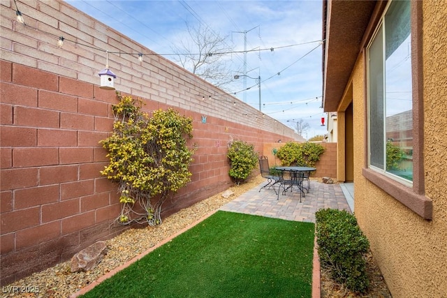 7611 Redcloud Peak St, Las Vegas, NV 89166 - fenced backyard featuring a patio area