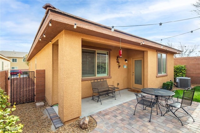 7611 Redcloud Peak St, Las Vegas, NV 89166 - view of patio / terrace with central air condition unit and a gate