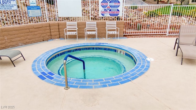 2040 Mesquite Ln Unit 203, Laughlin, NV 89029 - view of pool featuring a patio area, a community hot tub, and a swimming pool