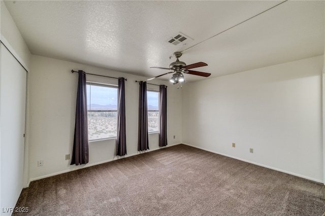 2040 Mesquite Ln Unit 203, Laughlin, NV 89029 - spare room featuring a ceiling fan, carpet, and baseboards