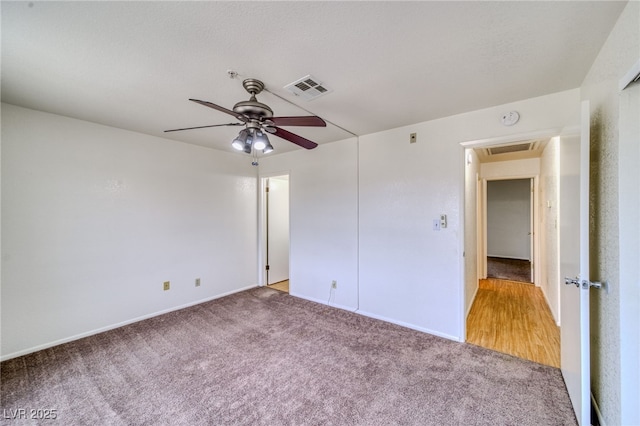 2040 Mesquite Ln Unit 203, Laughlin, NV 89029 - unfurnished bedroom with light carpet, baseboards, and ceiling fan