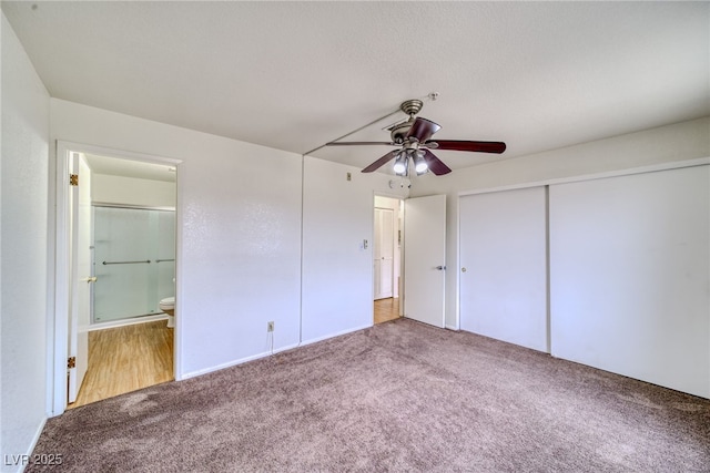 2040 Mesquite Ln Unit 203, Laughlin, NV 89029 - unfurnished bedroom with carpet, ensuite bathroom, a closet, and a ceiling fan