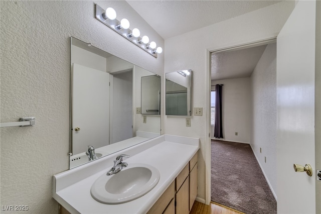 2040 Mesquite Ln Unit 203, Laughlin, NV 89029 - bathroom with vanity and a textured wall