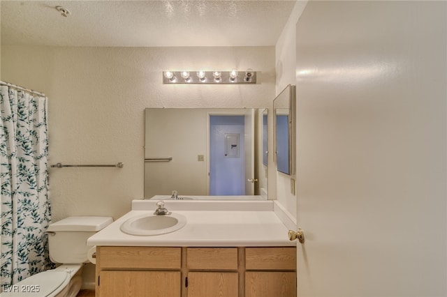 2040 Mesquite Ln Unit 203, Laughlin, NV 89029 - bathroom featuring toilet, vanity, and curtained shower