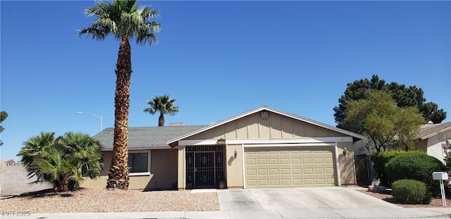 7104 Carrondale Way, Las Vegas, NV 89128 - single story home featuring an attached garage, driveway, and board and batten siding
