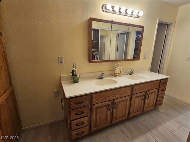 7104 Carrondale Way, Las Vegas, NV 89128 - full bathroom featuring double vanity and baseboards