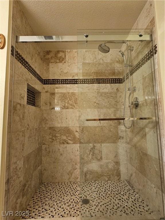7104 Carrondale Way, Las Vegas, NV 89128 - bathroom with a shower stall and a textured ceiling