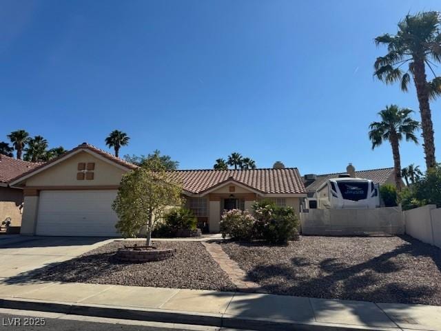 837 Holly Lake Way, Henderson, NV 89002 - ranch-style home with stucco siding, a tiled roof, an attached garage, and driveway