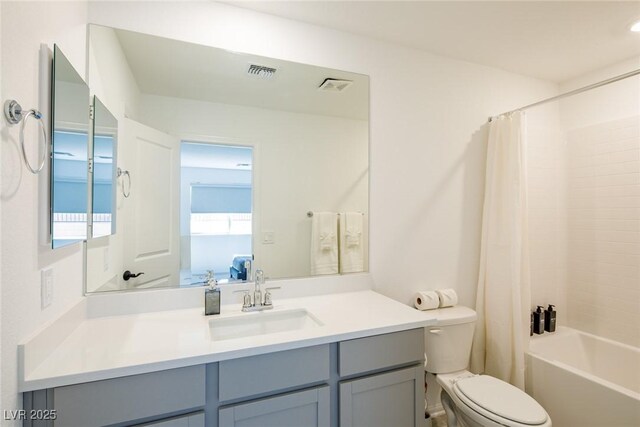 7499 Lodano Ave, Las Vegas, NV 89113 - ensuite bathroom featuring toilet, vanity, and shower / bath combination with curtain