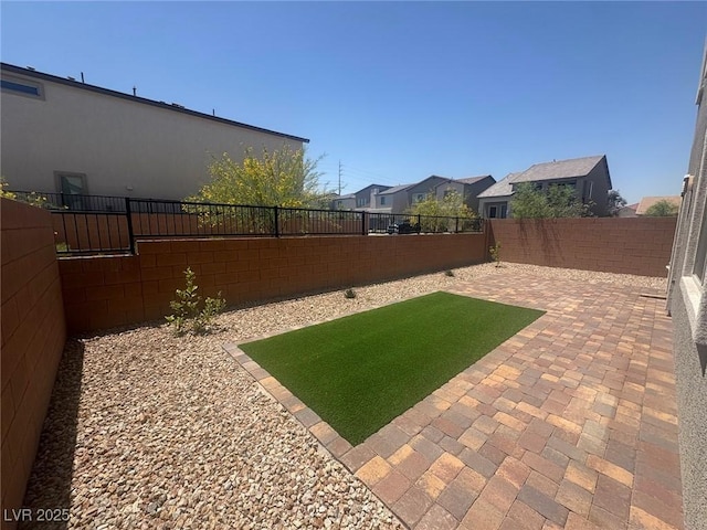 7499 Lodano Ave, Las Vegas, NV 89113 - fenced backyard with a patio