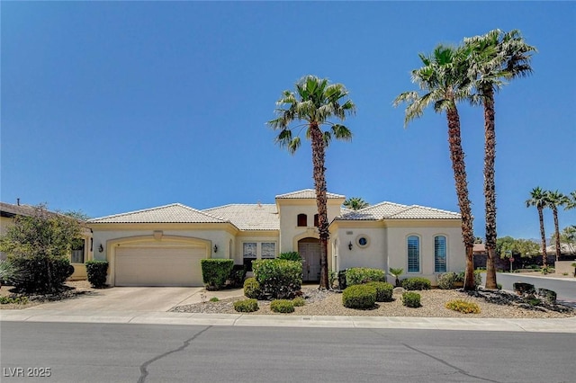 4845 Santo Romeo St, Las Vegas, NV 89135 - mediterranean / spanish-style house with a garage, a tile roof, and stucco siding