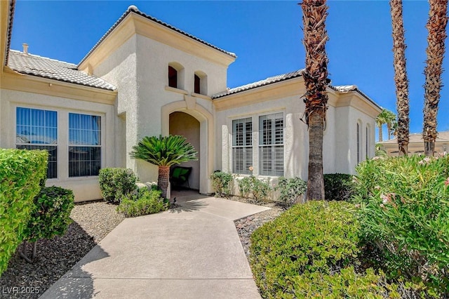 4845 Santo Romeo St, Las Vegas, NV 89135 - doorway to property with a tiled roof and stucco siding