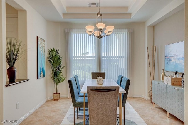 4845 Santo Romeo St, Las Vegas, NV 89135 - dining space featuring a chandelier, light tile patterned floors, a tray ceiling, and baseboards