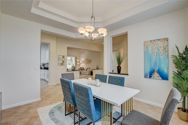 4845 Santo Romeo St, Las Vegas, NV 89135 - dining area with a chandelier, a raised ceiling, light tile patterned flooring, and baseboards
