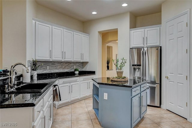 4845 Santo Romeo St, Las Vegas, NV 89135 - kitchen with stainless steel fridge, a sink, white cabinets, a center island, and recessed lighting