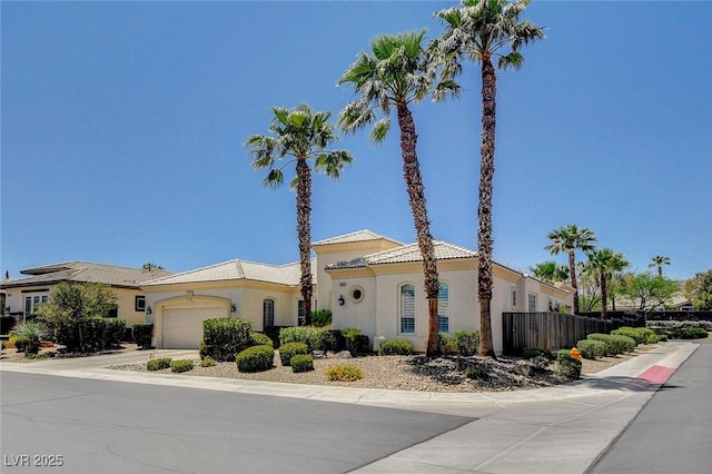 4845 Santo Romeo St, Las Vegas, NV 89135 - mediterranean / spanish-style house with an attached garage, stucco siding, and driveway