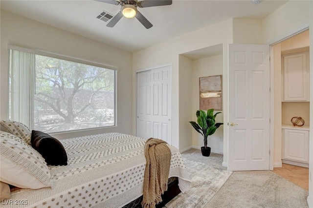 4845 Santo Romeo St, Las Vegas, NV 89135 - bedroom featuring a closet, light colored carpet, baseboards, and ceiling fan