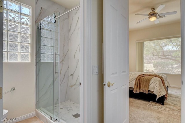 4845 Santo Romeo St, Las Vegas, NV 89135 - ensuite bathroom with a marble finish shower, healthy amount of natural light, a ceiling fan, and baseboards