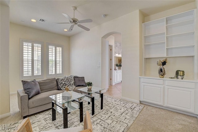 4845 Santo Romeo St, Las Vegas, NV 89135 - living area featuring arched walkways, ceiling fan, light carpet, baseboards, and recessed lighting