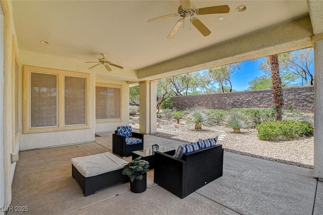 4845 Santo Romeo St, Las Vegas, NV 89135 - fenced backyard with ceiling fan, a patio area, and an outdoor living space