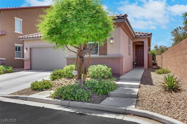 703 Shiva St, Las Vegas, NV 89178 - mediterranean / spanish-style home with a tile roof, stucco siding, concrete driveway, and a garage