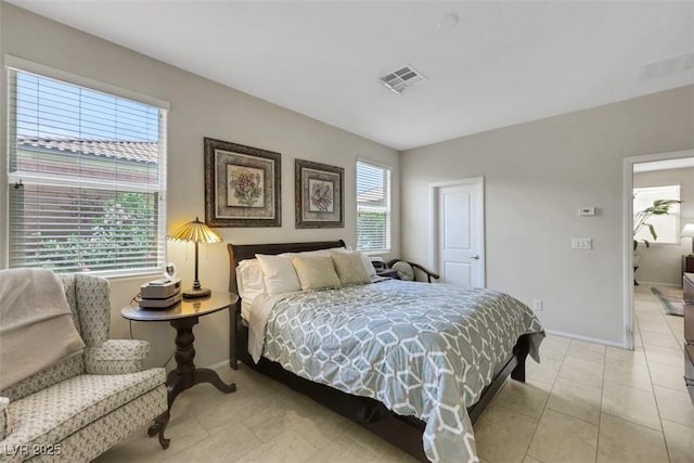 703 Shiva St, Las Vegas, NV 89178 - bedroom featuring baseboards and light tile patterned floors