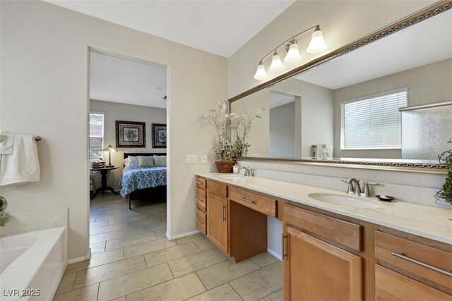 703 Shiva St, Las Vegas, NV 89178 - bathroom with healthy amount of natural light, tile patterned floors, double vanity, and ensuite bathroom