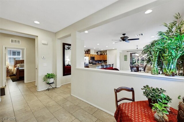 703 Shiva St, Las Vegas, NV 89178 - kitchen with appliances with stainless steel finishes, a ceiling fan, plenty of natural light, light tile patterned flooring, and recessed lighting