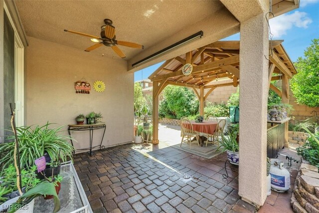 703 Shiva St, Las Vegas, NV 89178 - view of patio / terrace featuring a gazebo, ceiling fan, and outdoor dining area