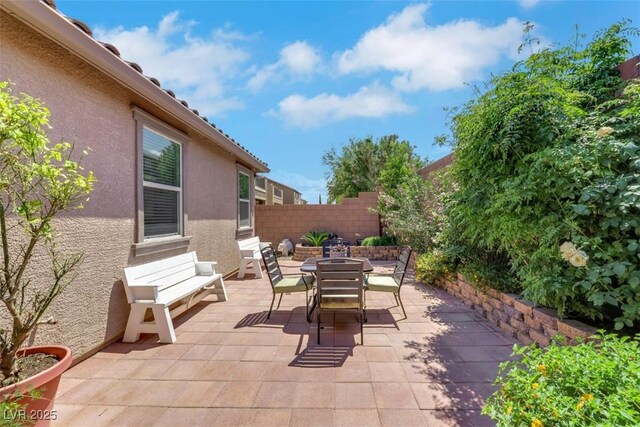 703 Shiva St, Las Vegas, NV 89178 - view of patio / terrace with outdoor dining space and entry steps