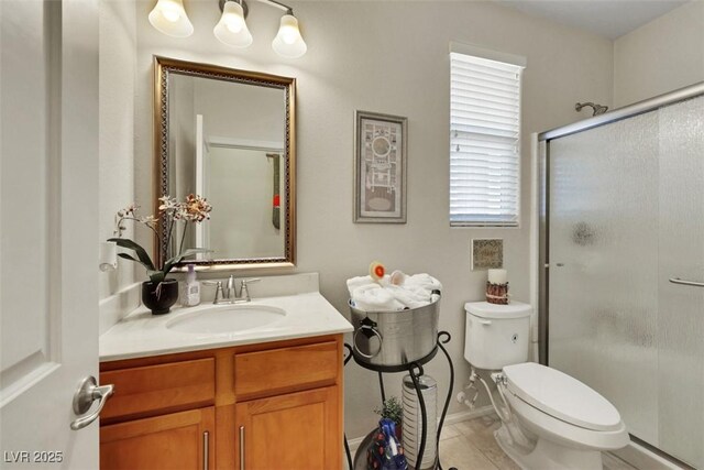 703 Shiva St, Las Vegas, NV 89178 - full bathroom featuring a stall shower, toilet, vanity, and tile patterned floors